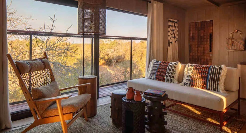 A lounge area opens onto the bush at Anantara Tented Camp Kafue River.