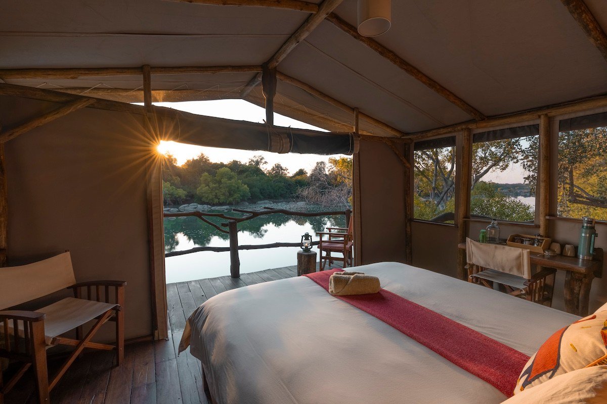 A tented room looks out over the river at Kasabushi Camp.