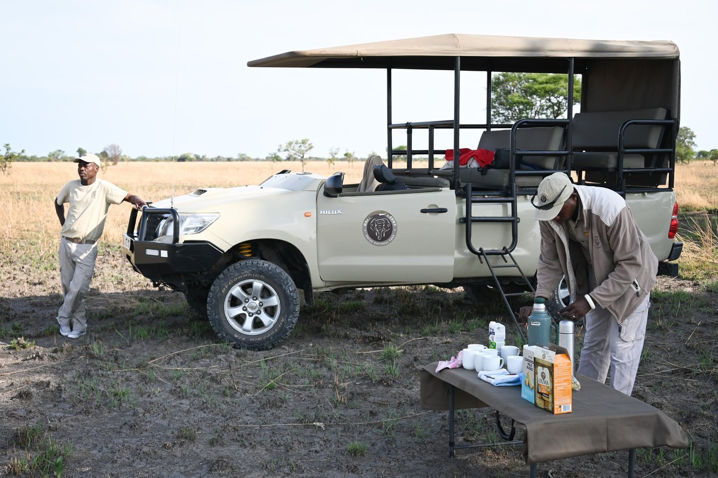 Staff prepare a self-drive vehicle in the yard at Mapunga Bush Camp.