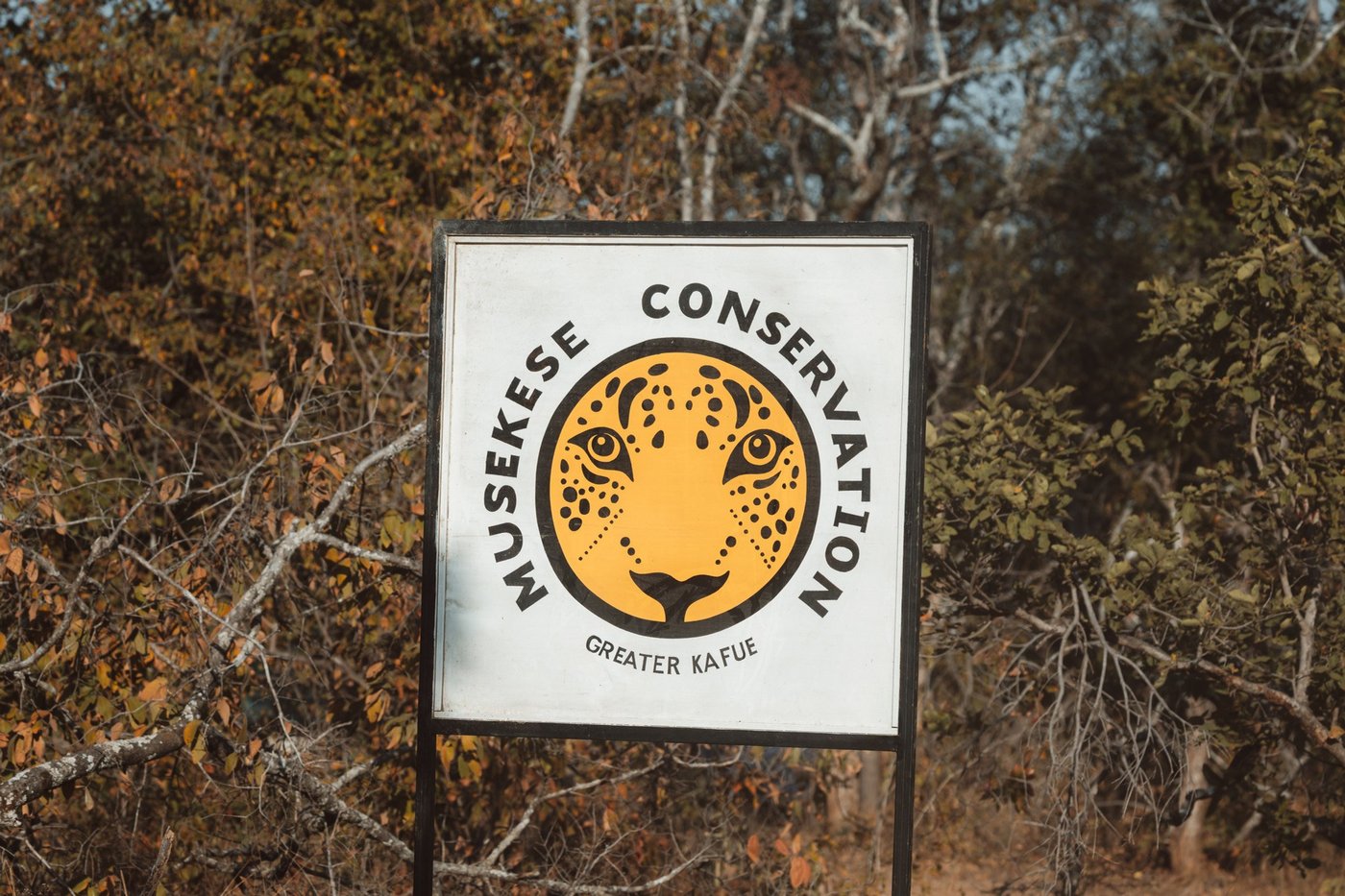 A conservation signboard marks the anti-poaching base funded by guests of Musekese Camp.
