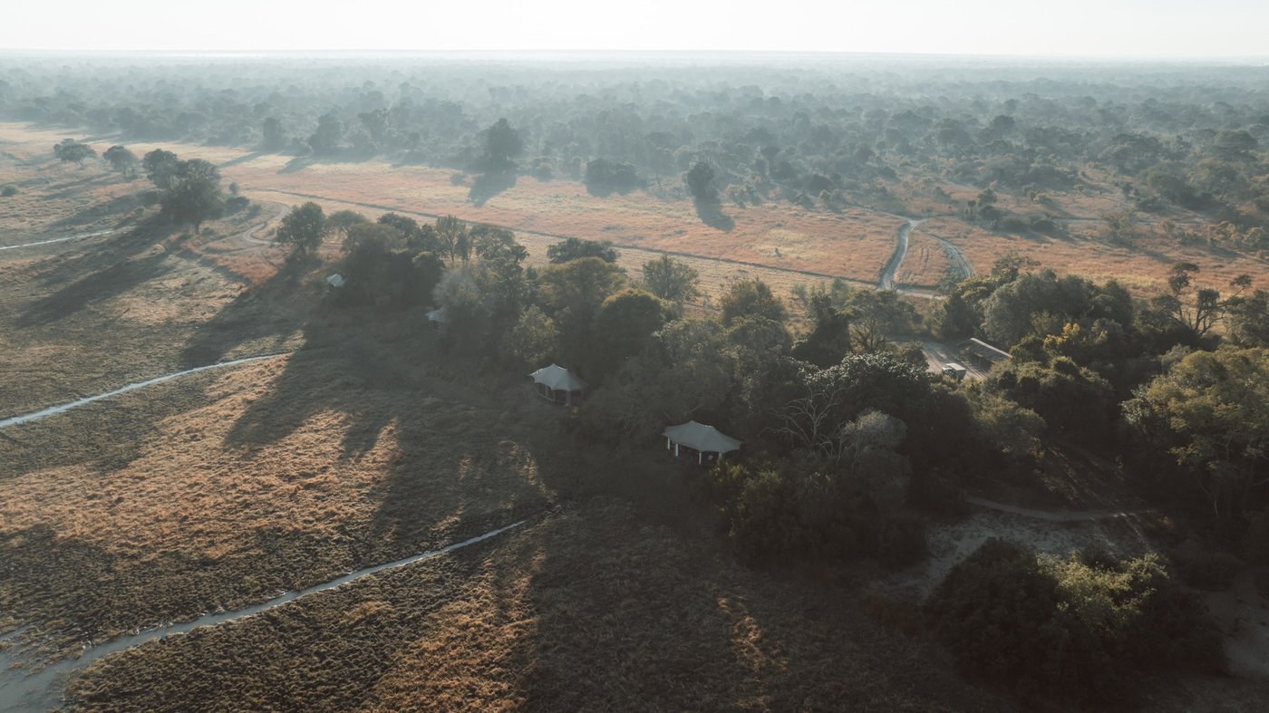 An aerial view shows the river forest and lagoon around Musekese Camp.