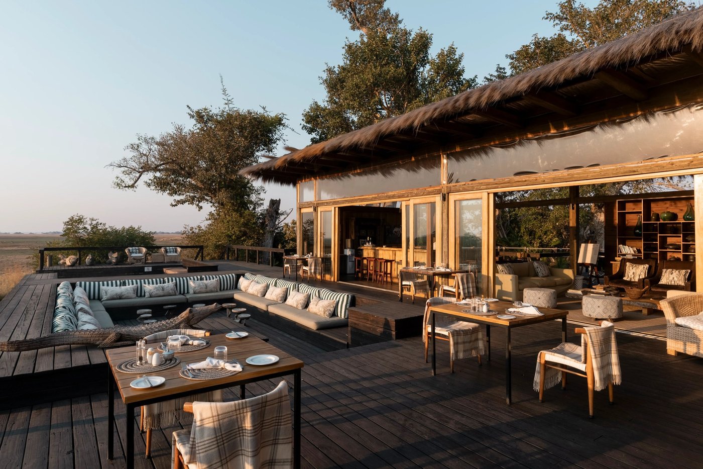 Open-air dining deck overlooking the Busanga floodplain at Shumba Camp in Kafue.